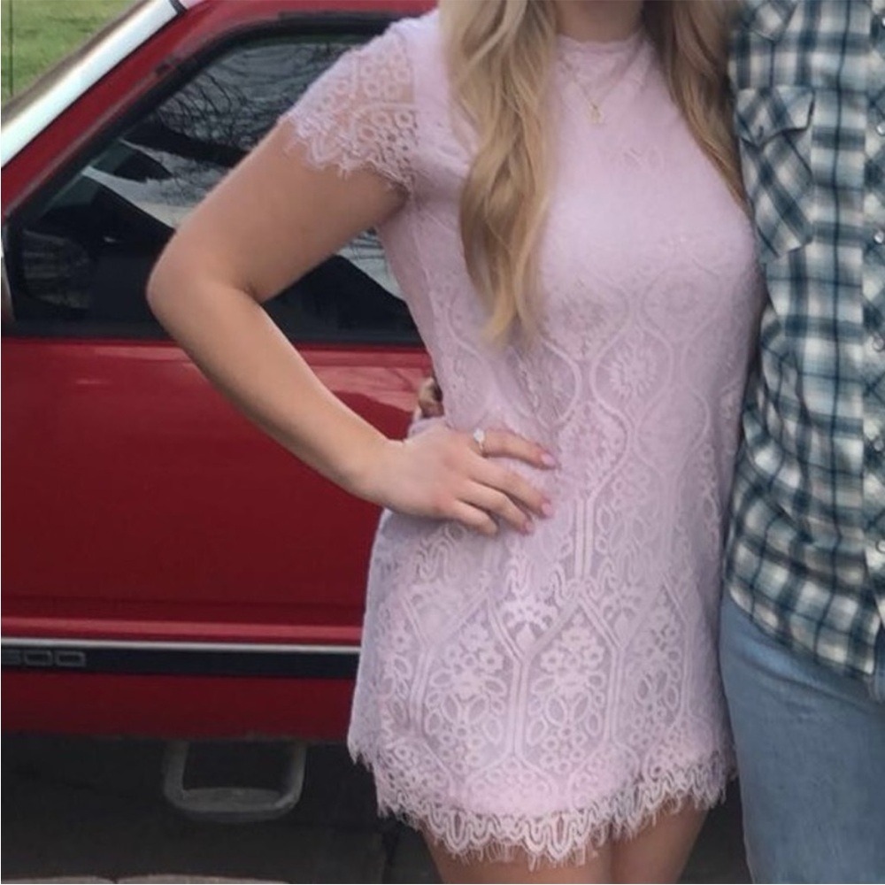 Francesca’s Mi Ami Lace Dress. Button close in back, body double lined.